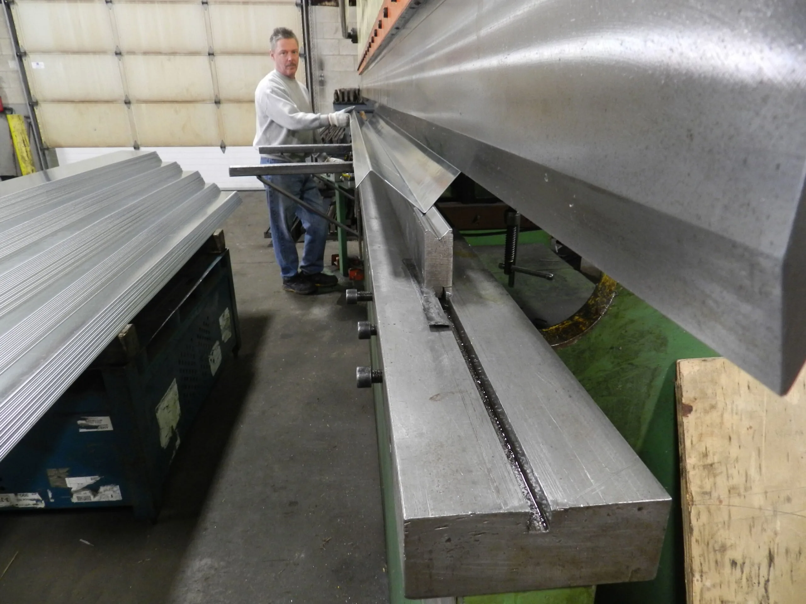 Sheet metal bending operation forming stamped brackets in production