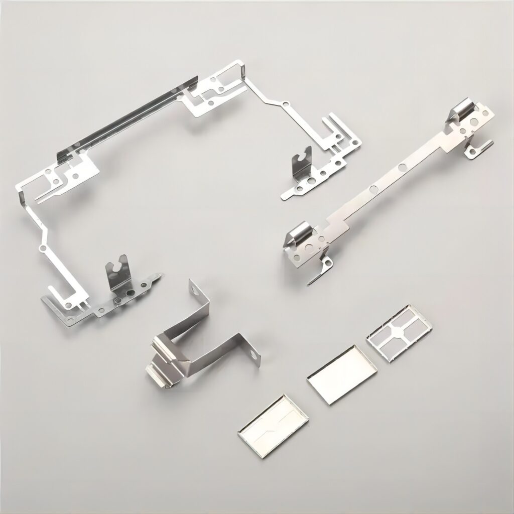 Engineer reviewing metal stamping design drawing with parts samples | metalstampingparts.ltd