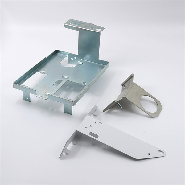 Variety of stamped metal components — brackets, EMI shields, clips, and structural parts