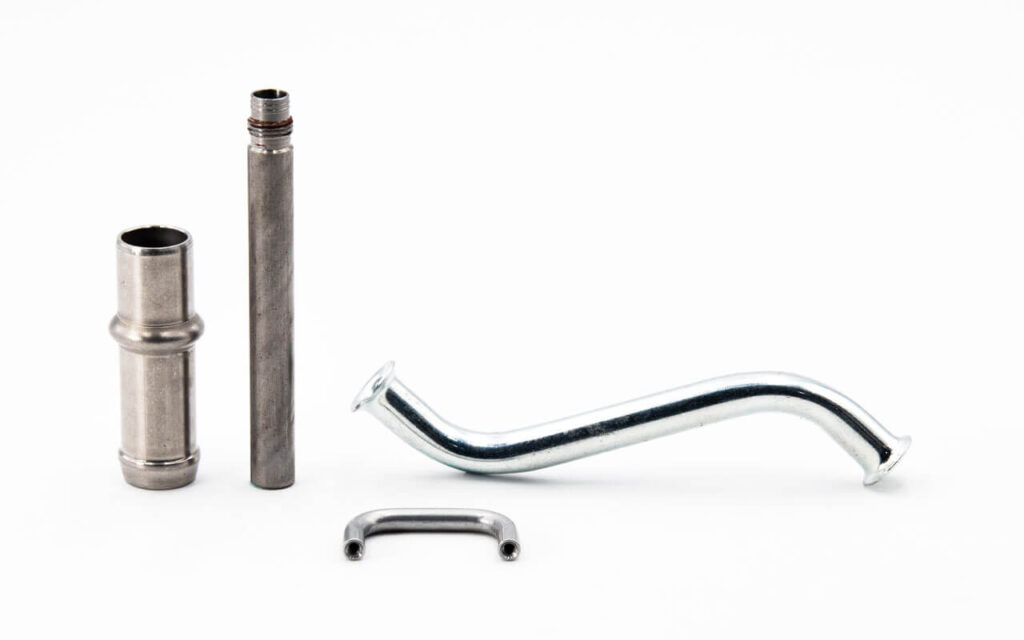 Variety of precision OEM stamped metal parts — brackets, terminals, housings, and structural components