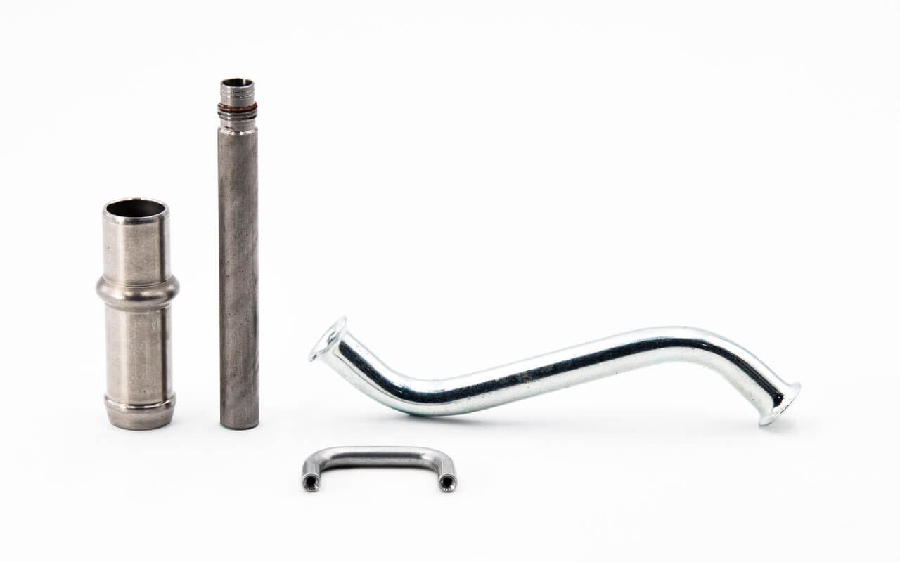 Variety of precision OEM stamped metal parts — brackets, terminals, housings, and structural components