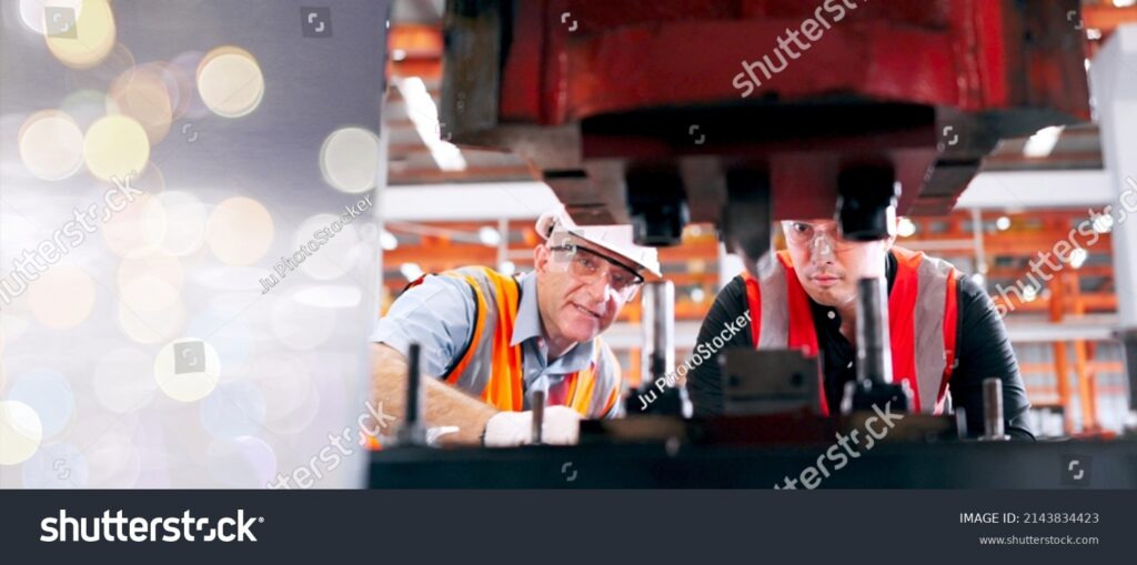 Engineer reviewing OEM stamped metal parts, drawings, and quality requirements