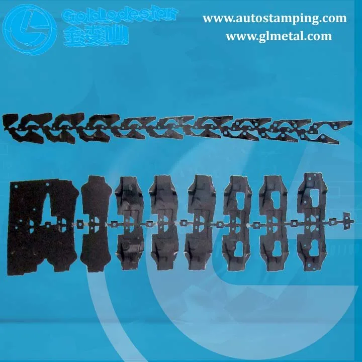 Progressive die stamping strip showing metal parts being formed in sequential stations